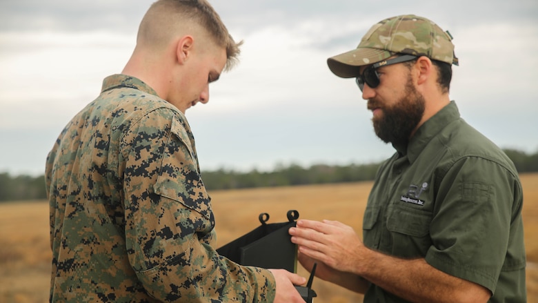 Shaun Sorensen, right, a small unmanned aerial systems instructor with Training and Logistics Support Activity, instructs a Marine with Task Force Southwest on proper controls for the Instant Eye SUAS at Marine Corps Base Camp Lejeune, North Carolina, Feb. 8, 2017. The Instant Eye is the first drone in the Marine Corps’ repertoire that can launch and land without a runway or manpower assistance. Approximately 300 Marines are assigned to Task Force Southwest, whose mission will be to train, advise and assist the Afghan National Army 215th Corps and 505th Zone National Police.