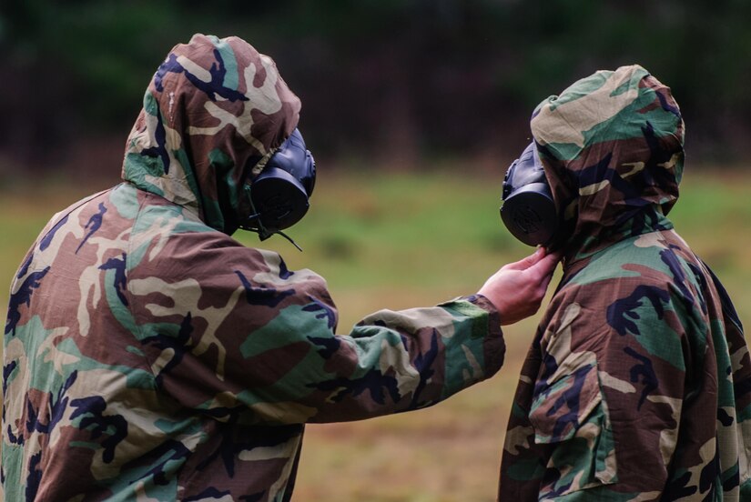 Two soldiers from Headquarters and Headquarters Company, 301st Maneuver Enhancement Brigade, inspect the other’s Joint Service Lightweight Integrated Suit Technology (JSLIST) Chemical Protective Ensembles preparation for a Chemical, Biological, Radiological, or Nuclear attack or incident on U.S. soil at Joint Base Lewis-McChord, Washington, January 21, 2017. The purpose of the training was to familiarize soldiers with the M50 Joint Service General Purpose Mask, and to ensure that they are prepared to respond to a CBRN incident or attack. 