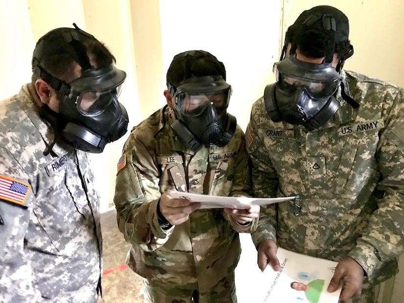 Soldiers from Headquarters and Headquarters Company, 301st Maneuver Enhancement Brigade, read a series of phrases to ensure the fit and breathability of the M50 Joint Service General Purpose Mask at Joint Base Lewis-McChord, Washington, January 21, 2017. The purpose of the training was to familiarize soldiers with the M50 Joint Service General Purpose Mask, and to ensure that they are prepared to respond to a CBRN incident or attack. 