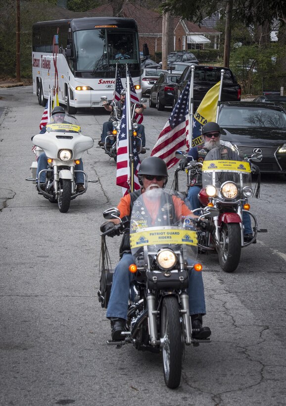 The Patriot Guard Riders of Georgia escort Soldiers with U.S. Army Reserve Detachment 6, 335th Signal Command (Theater) (in bus) as they leave for a nine-month deployment to the Middle East from the command headquarters in East Point, Ga., Feb. 12, 2017. 