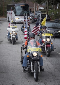 The Patriot Guard Riders of Georgia escort Soldiers with U.S. Army Reserve Detachment 6, 335th Signal Command (Theater) (in bus) as they leave for a nine-month deployment to the Middle East from the command headquarters in East Point, Ga., Feb. 12, 2017. 