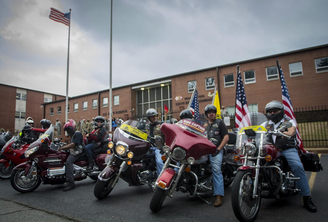 The Patriot Guard Riders of Georgia wait outside the 335th Signal Command (Theater) headquarters to escort Detachment 6 to the airport after a deployment ceremony in East Point, Ga., Feb. 12, 2017. 