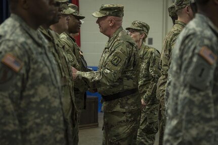 U.S. Army Reserve Maj. Gen. Peter Bosse, commander of the 335th Signal Command (Theater), walks through a formation of Soldiers with Detachment 6 to shake their hands during their deployment ceremony at the command headquarters in East Point, Ga., Feb. 12, 2017. 