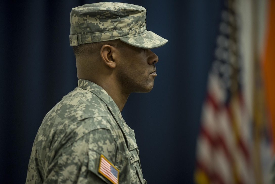 U.S. Army Reserve 1st Sgt. Warren Waugh, of Detachment 6, 335th Signal Command (Theater), stands in formation at the position of attention during a deployment ceremony at the command headquarters in East Point, Ga., Feb. 12, 2017. 