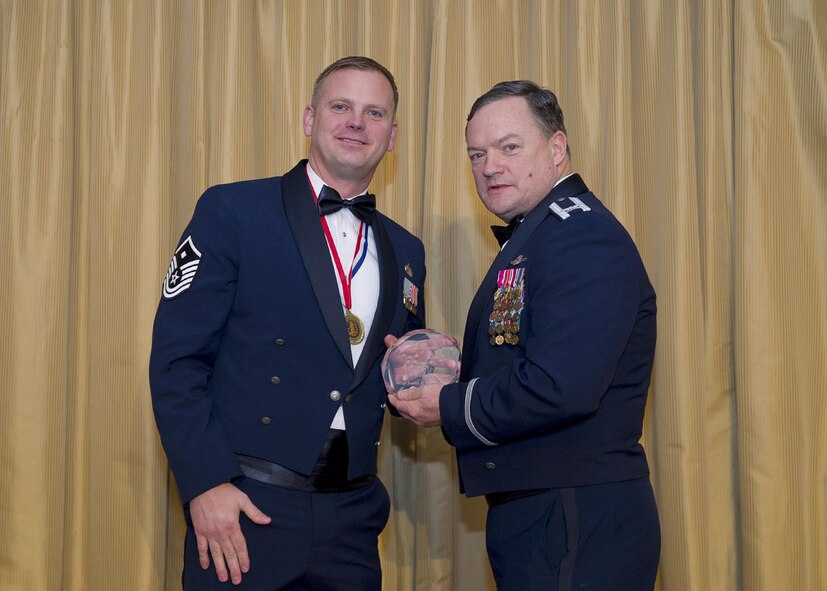 Master Sgt. James Meehan Jr., 78th Air Refueling Squadron, receives the First Sergeant of the Year award from Col. David Pavey, 514th Air Mobility Wing commander, during the wing's annual awards banquet Feb. 11.