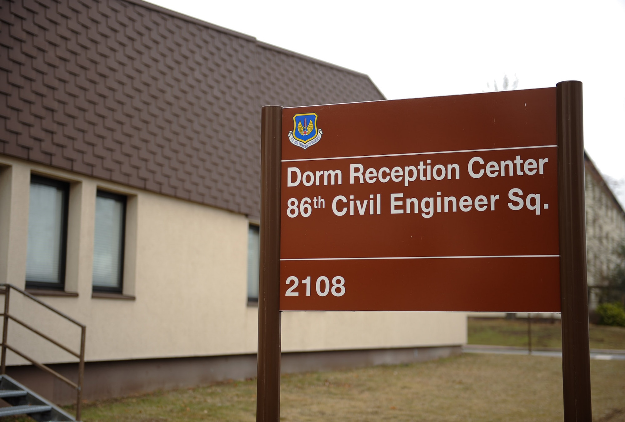 The Dorm Reception Center sign is displayed on Ramstein Air Base, Germany, Feb. 7, 2017. Ramstein’s Dorm Reception Center and the Vogelweh Housing Office are dedicated to ensuring that Airmen who are moving from the dorms experience a smooth transition. (U.S. Air Force photo by Airman 1st Class Savannah L. Waters)