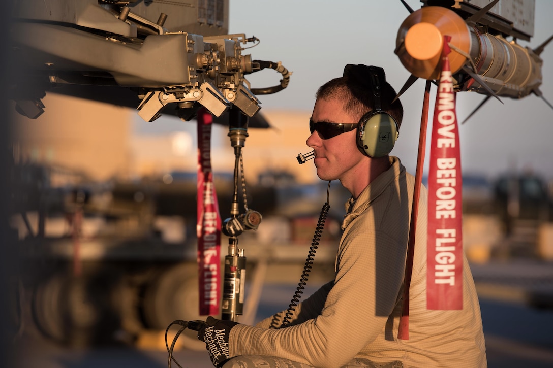 Air Force Tech. Sgt. Joseph Benoit tests the weapons rack releasing system on an F-16 Fighting Falcon aircraft in Southwest Asia, Feb. 6, 2017. Benoit is a weapons specialist assigned to the Vermont Air National Guard’s 407th Expeditionary Maintenance Squadron. Air Force photo by Master Sgt. Benjamin Wilson