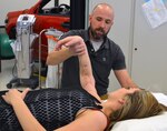 Christopher Ebner, occupational therapist, exercises Kelsey Ward’s arm Jan. 20 at the Center for the Intrepid at Joint Base San Antonio-Fort Sam Houston. Ward’s arm was severed when a guardrail pierced the passenger-side window of her SUV in a car wreck April 20, 2016. Brooke Army Medical Center surgeons performed their first above-the-elbow arm replant on the 22-year-old trauma patient and almost 10 months later, she is thriving.