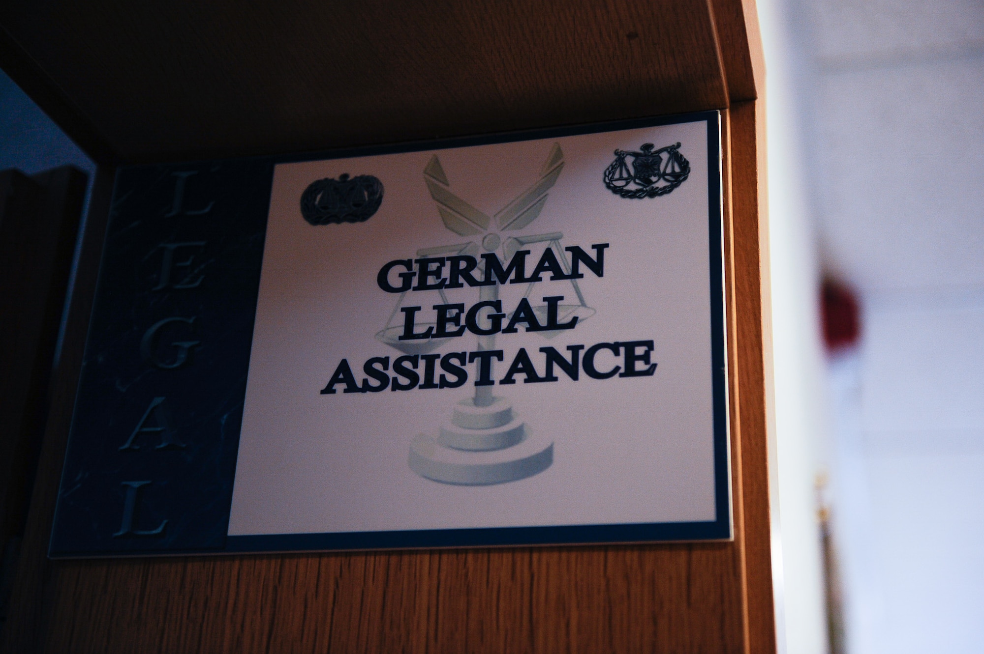 A German Legal Assistance sign is displayed at the 86th Airlift Wing Ramstein Law Center on Ramstein Air Base, Germany, Feb. 10, 2017. Aspiring entrepreneurs that wish to run a private business on base may consult the Vogelweh Housing Office or the base legal office to ensure they are in compliance with Air Force Instruction and regulations. (U.S. Air Force photo by Airman 1st Class Savannah L. Waters)