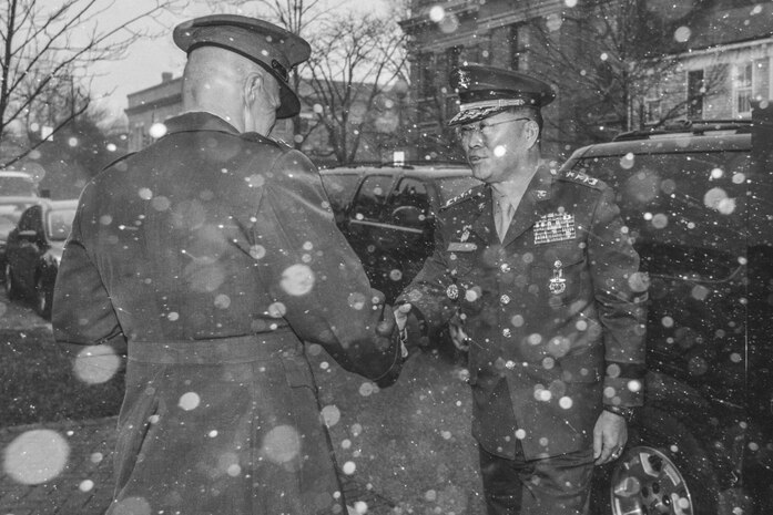Commandant of the Marine Corps Gen. Robert B. Neller, left, shakes hands with Lt. Gen. Lee Sang-Hoon, commandant of the Republic of Korea Marine Corps, at the Home of the Commandants, Washington, D.C., Feb. 9, 2017. Neller hosted Sang-Hoon for an honors ceremony and dinner. (U.S. Marine Corps photo by Cpl. Samantha K. Braun) 