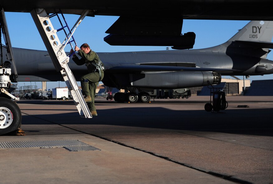 Maj. Gen. Richard Scobee, 10th Air Force commander, climbs a ladder to board a B-1B Lancer at Dyess Air Force Base, Texas, Feb. 11, 2017. This is a B-1B Lancer familiarization flight, which exposes rated aviators to the B-1 mission. (U.S. Air Force photo by Airman 1st Class April Lancto)