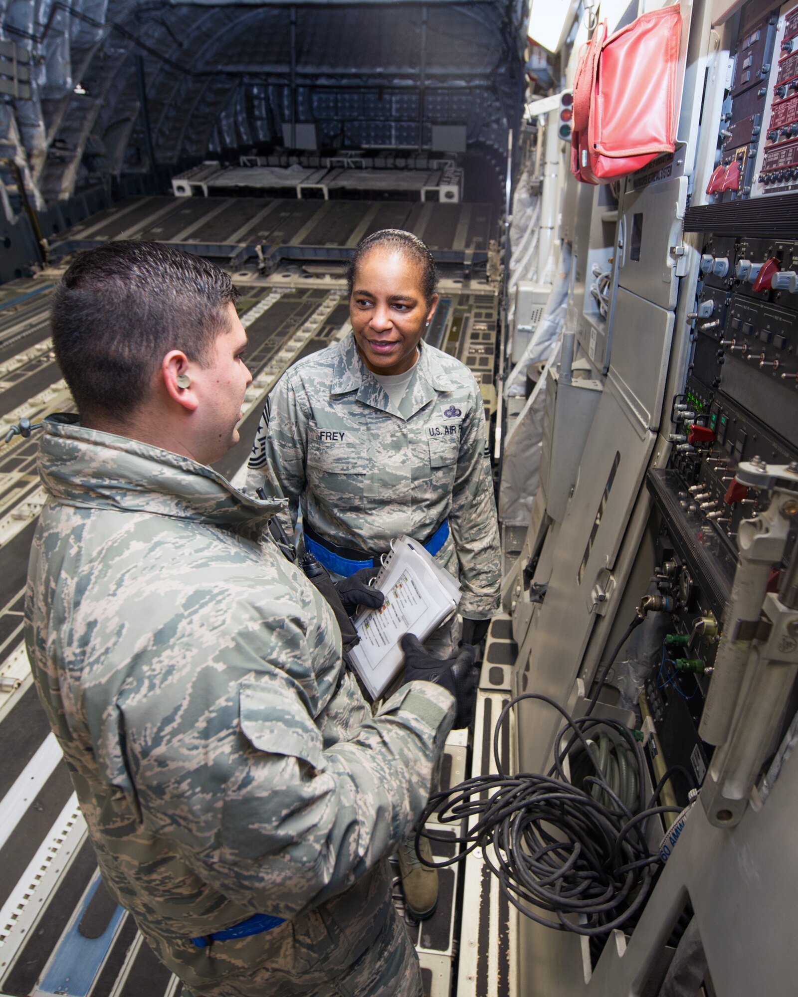 U.S. Air Force Chief Master Sgt. Shelina Frey, Air Mobility Command command chief, Scott Air Force Base Ill., gets a briefing inside a C-17 Globemaster III during her tour of the 60th Aerial Port Squadron at Travis Air Force Base, Calif., Feb. 8, 2016. Frey is on a five-day tour to Travis visiting with Airmen, observing operations and recognizing the newest chief master sergeants. (U.S. Air Force photo/Louis Briscese)