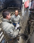 U.S. Air Force Chief Master Sgt. Shelina Frey, Air Mobility Command command chief, Scott Air Force Base Ill., gets a briefing inside a C-17 Globemaster III during her tour of the 60th Aerial Port Squadron at Travis Air Force Base, Calif., Feb. 8, 2016. Frey is on a five-day tour to Travis visiting with Airmen, observing operations and recognizing the newest chief master sergeants. (U.S. Air Force photo/Louis Briscese)