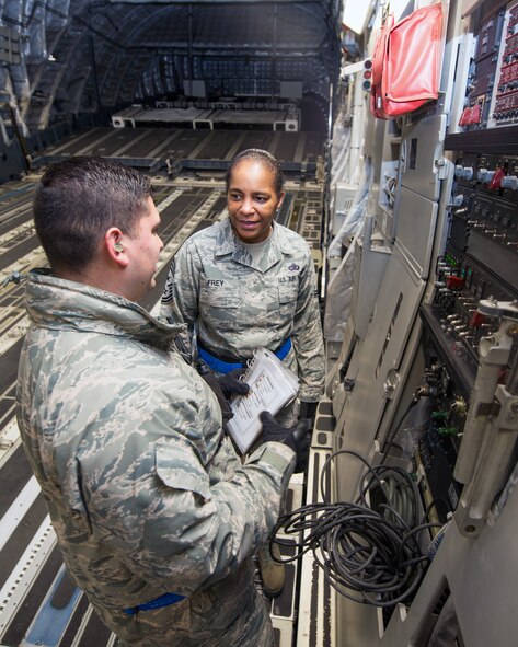 U.S. Air Force Chief Master Sgt. Shelina Frey, Air Mobility Command command chief, Scott Air Force Base Ill., gets a briefing inside a C-17 Globemaster III during her tour of the 60th Aerial Port Squadron at Travis Air Force Base, Calif., Feb. 8, 2017. Frey is on a five-day tour to Travis visiting with Airmen, observing operations and recognizing the newest chief master sergeants. (U.S. Air Force photo/Louis Briscese)