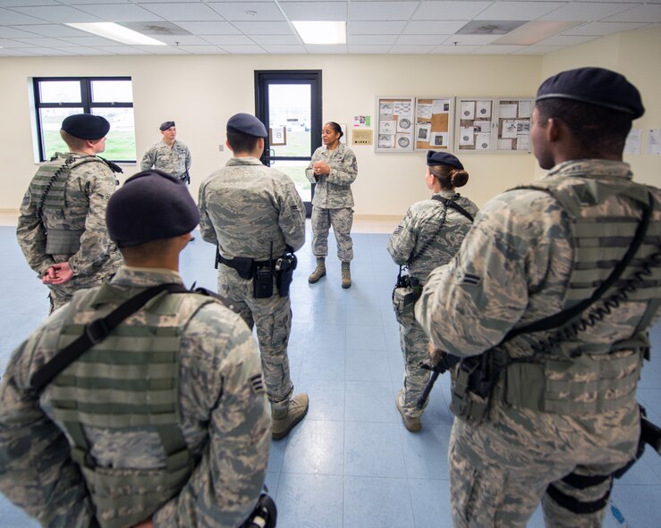 U.S. Air Force Chief Master Sgt. Shelina Frey, Air Mobility Command command chief, Scott Air Force Base Ill., speaks with  defenders from the 60th Security Forces Squadron during her tour of Travis Air Force Base, Calif., Feb. 8, 2017. Frey is on a five-day tour to Travis visiting with Airmen, observing operations and recognizing the newest chief master sergeants. (U.S. Air Force photo/Louis Briscese)