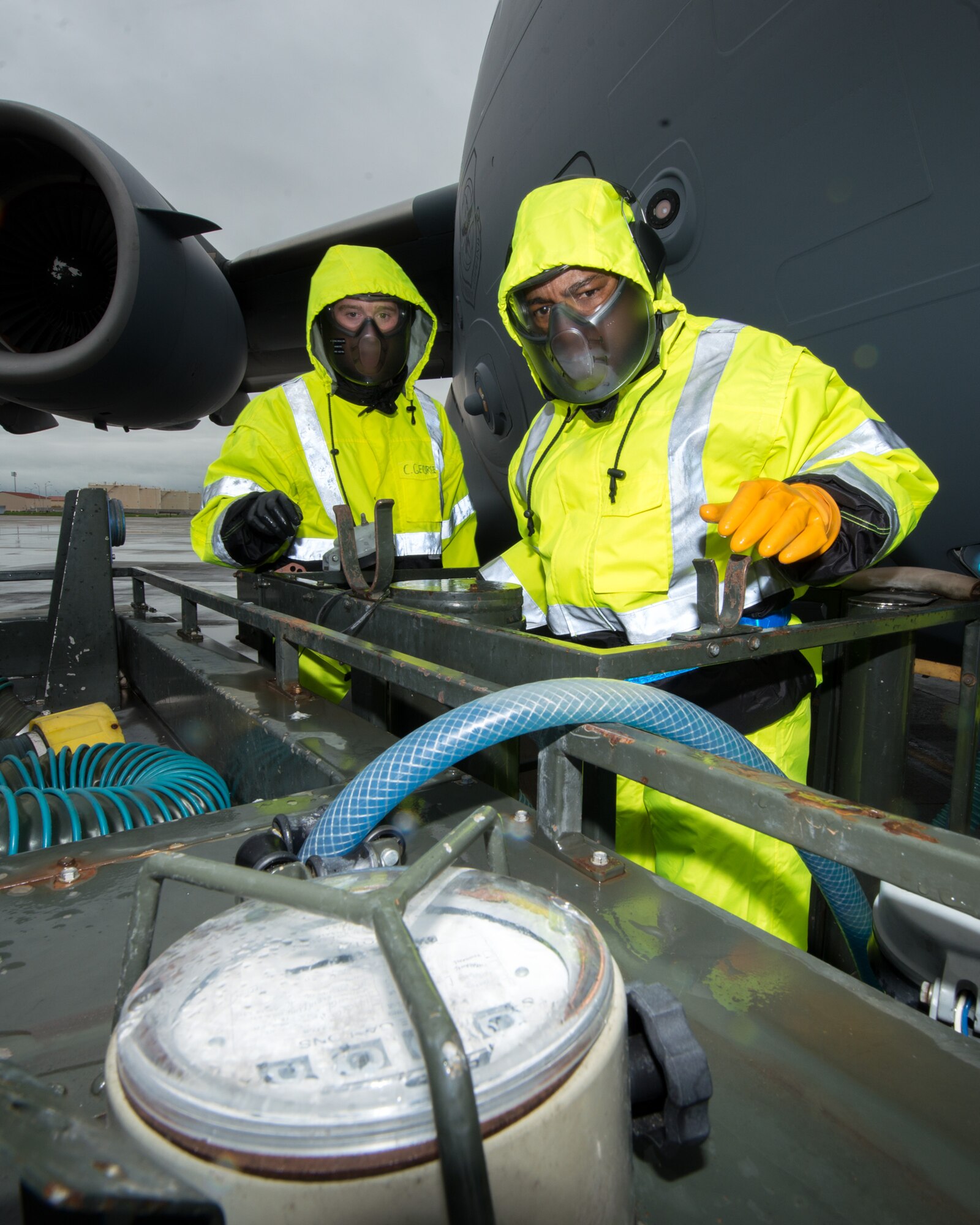 U.S. Air Force Chief Master Sgt. Shelina Frey, Air Mobility Command command chief, Scott Air Force Base Ill., hooks up a hose to a C-17 Globemaster III during her tour of the 60th Aerial Port Squadron at Travis Air Force Base, Calif., Feb. 8, 2017. Frey is on a five-day tour to Travis visiting with Airmen, observing operations and recognizing the newest chief master sergeants. (U.S. Air Force photo/Louis Briscese)