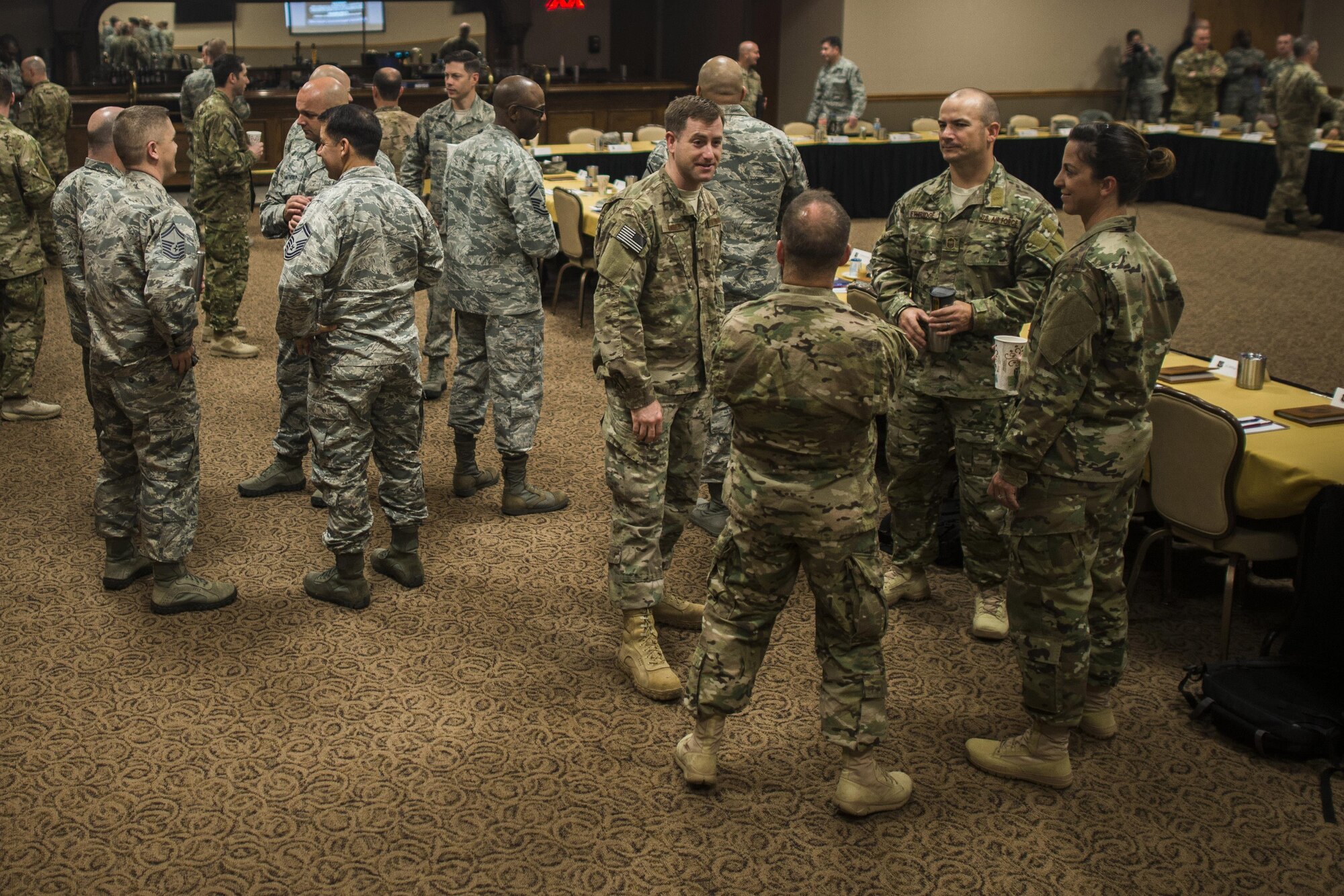 Attendees talk with one another before the start of the Air Force Special Operations Command Chiefs Orientation course Feb. 7, 2017, at Cannon Air Force Base, N.M.  More than 30 chiefs from across AFSOC attended the orientation to network and share leadership styles. (U.S. Air Force photo by Senior Airman Luke Kitterman/Released) 