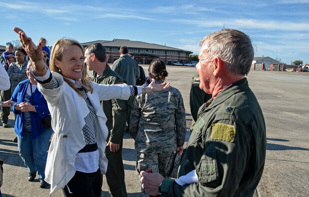 Former 317th Airlift Squadron member, retired Lt. Col. Debi Rieflin congratulates retiring Lt. Col. Rick Davis, 317th AS, after Davis' "fini flight" in a Joint Base CHarleston C-17 Feb. 10. (U.S.Air Force photo by Michael Dukes)