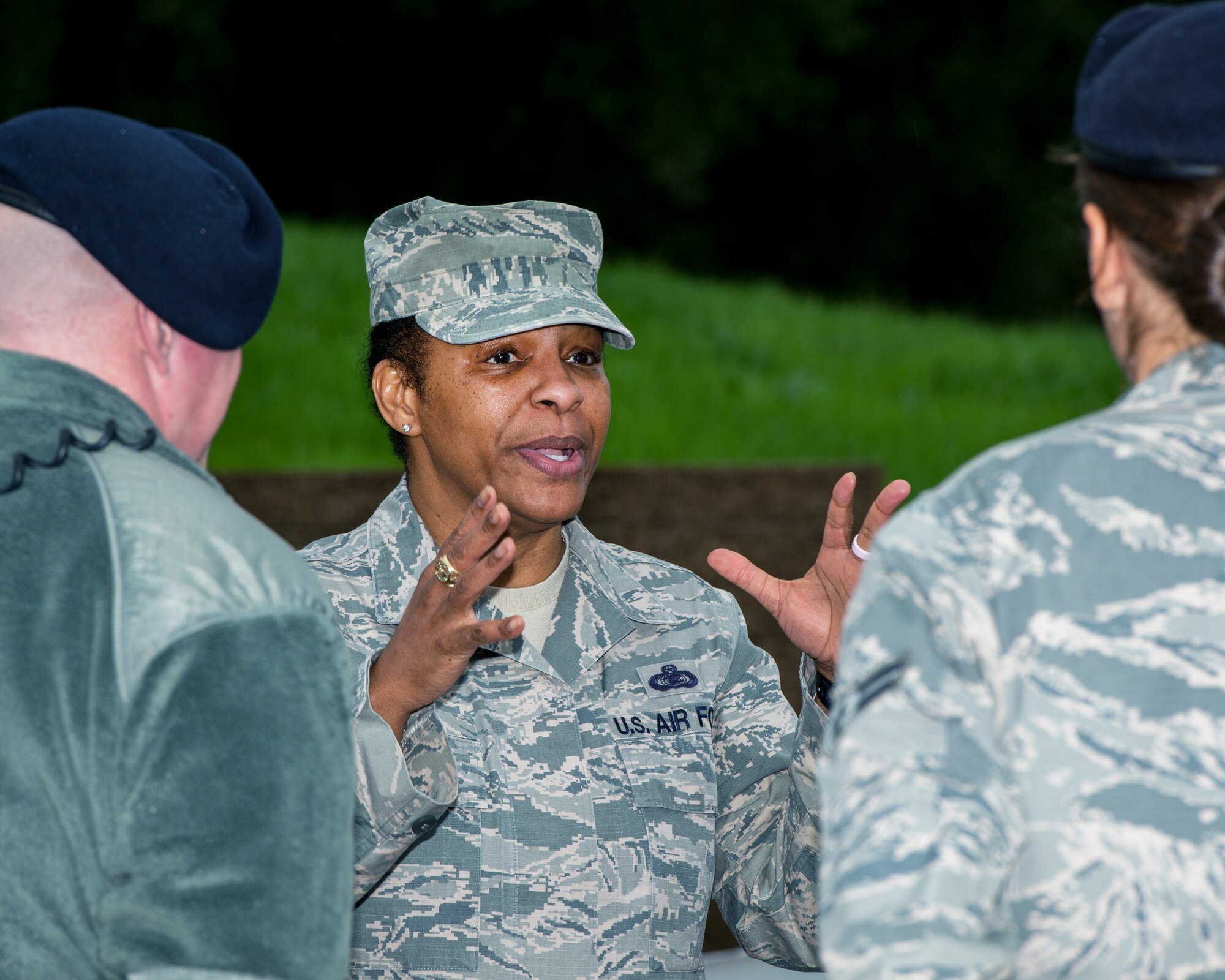 U.S. Air Force Chief Master Sgt. Shelina Frey, Air Mobility Command command chief, Scott Air Force Base Ill., speaks with  defenders from the 60th Security Forces Squadron during her tour of Travis Air Force Base, Calif., Feb. 8, 2016. Frey is on a five-day tour to Travis visiting with Airmen, observing operations and recognizing the newest chief master sergeants. (U.S. Air Force photo/Louis Briscese)