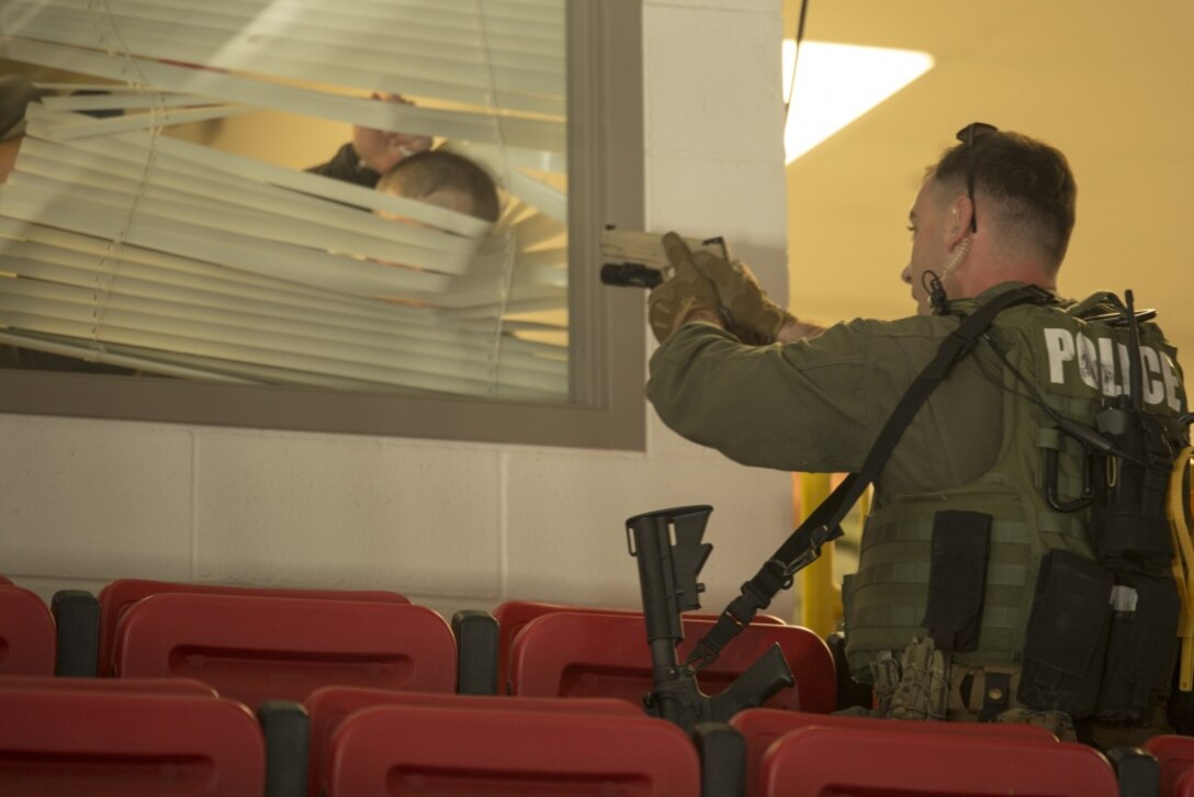 A member of the Special Response Team sights in on a simulated active shooting suspect during an anti-terrorism/force protection exercise on Parris Island, S.C., Feb. 2, 2017. The exercise simulated an active shooter and hostage situation and was designed to test various aspects of the depot’s emergency response capabilities. (Photo by Cpl. Aaron Bolser)