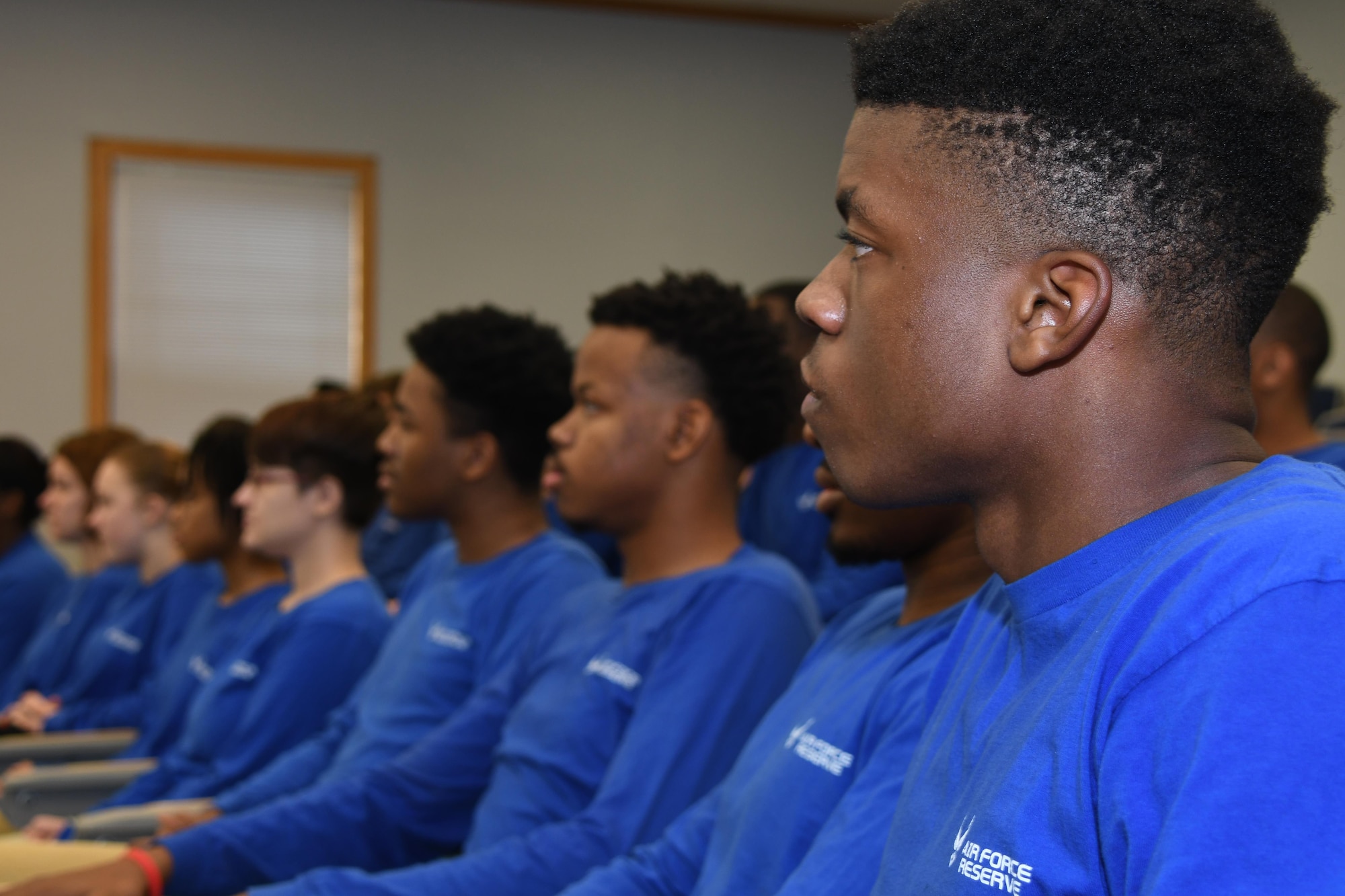 U.S. Air Force trainees from the 307th Developmental Training Flight pay close attention to Master Sgt.  Carlos Recorder, 433rd Training Squadron military training instructor, during a speech at Barksdale Air Force Base, La., Feb. 11, 2017.  The 307th DTF is designed to help trainees who have enlisted and are waiting to go to basic military training.  Recorder was on hand to tell the trainees how to best prepare physically and mentally for the challenges of BMT.  (U.S. Air Force photo by Tech. Sgt. Ted Daigle/Released)