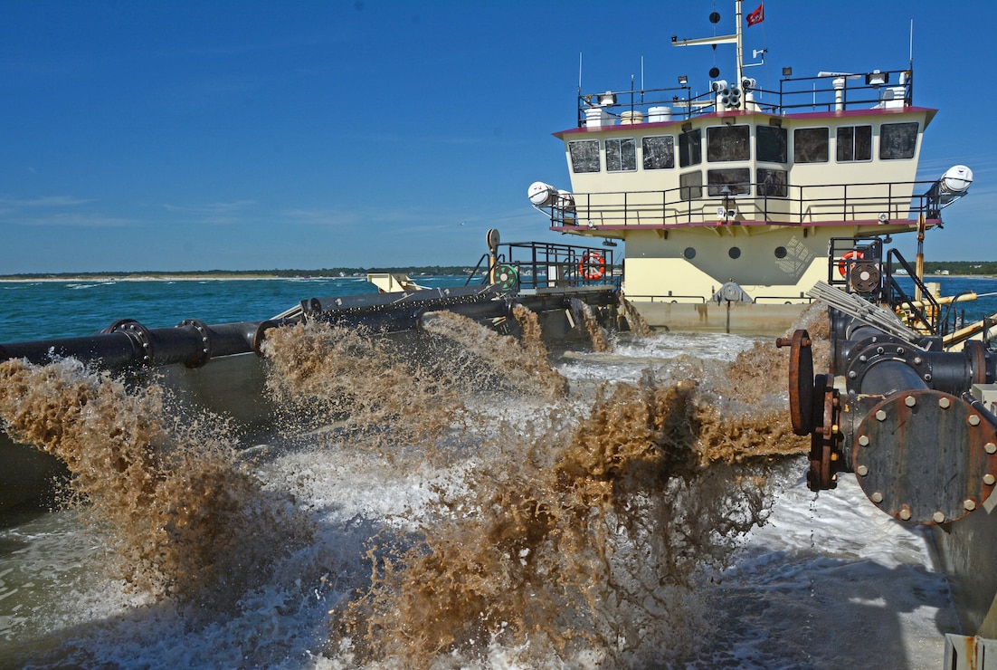 The shallowdraft, split hull vessel MURDEN dredges the federal channel at Carolina Beach Inlet.  