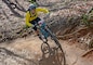 A mountain bicyclist rounds a high berm during the Six Hours of Warrior Creek mountain bike race at W. Kerr Scott Dam and Reservoir. 