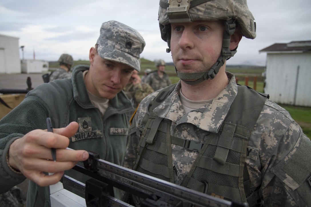 U.S. Army soldier Staff Sgt. Matthew Cassidy is weighed in before the ruck march during the Best Warrior Competition Fort Hunter Liggett, Calif. on February 8, 2016. The course was 6 miles long and the rucks weighed around 35 pounds. 