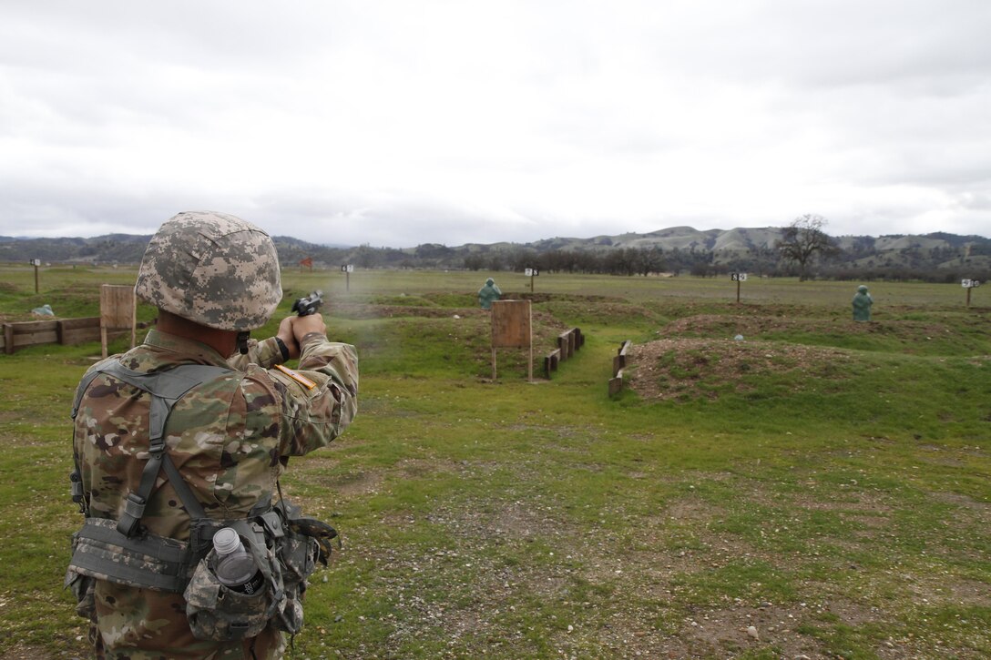 U.S. Army Reserve soldier Pfc. Juan Millan fires the M9 during the Best Warrior Competition, Fort Hunter Liggett, Calif. on February 9, 2017. The candidates shot the M9 during reactive fire training. 