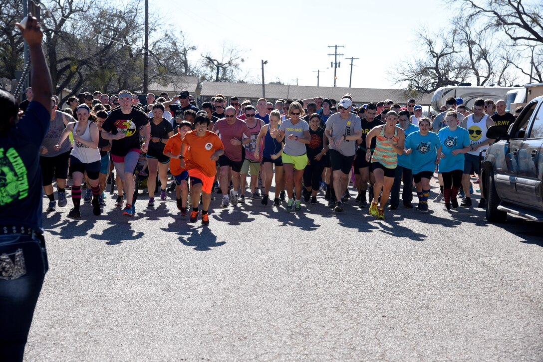 Runners begin the Polar Bear Party 5K at the Goodfellow Air Force Base Recreation Camp in San Angelo, Texas, Feb. 11, 2017. Nearly 250 people showed up for the run and swam in Lake Nasworthy. (U.S. Air Force photo by Staff Sgt. Joshua Edwards/Released)