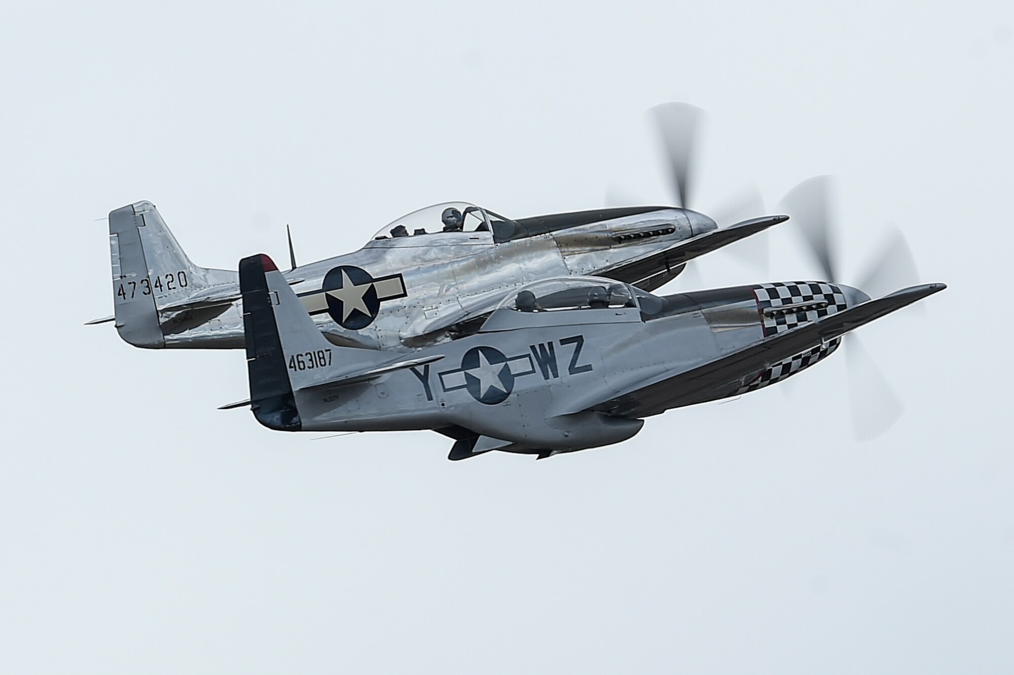 A TF-51 and P-51 Mustang fly together during the 2017 Heritage Flight Training and Certification Course at Davis-Monthan Air Force Base, Ariz., Feb. 12, 2017. The 20th annual training event has been held at D-M since 2001 and features aerial demonstrations from historical and modern fighter aircraft. (U.S. Air Force photo by Senior Airman Chris Drzazgowski)