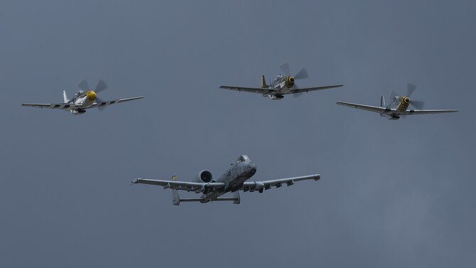A U.S. Air Force A-10C Thunderbolt II, a TF-51 and two P-51 Mustangs fly in formation during the 2017 Heritage Flight Training and Certification Course at Davis-Monthan Air Force Base, Ariz., Feb. 12, 2017. During the course, aircrews practice ground and flight training to enable civilian pilots of historic military aircraft and U.S. Air Force pilots of current fighter aircraft to fly safely in formations together. (U.S. Air Force photo by Senior Airman Chris Drzazgowski)