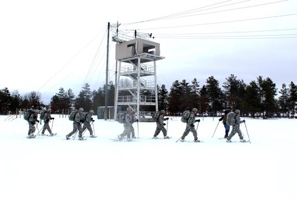 Soldiers with the 181st Multi-Functional Training Brigade participate in a snowshoe skills training session Jan. 26, 2017, at Training Area D-10 as part of the Cold-Weather Operations Course at Fort McCoy. The Cold-Weather Operations Course is the first of its kind coordinated by the Directorate of Plans, Mobilization, Training and Security, or DPTMS. It includes participation by 11 Soldiers with the 181st and is taught by two instructors contracted to support DPTMS. (U.S. Army Photo by Scott T. Sturkol, Public Affairs Office, Fort McCoy)