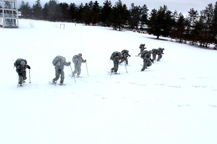 Soldiers with the 181st Multi-Functional Training Brigade participate in a snowshoe skills training session Jan. 26, 2017, at Training Area D-10 as part of the Cold-Weather Operations Course at Fort McCoy. The Cold-Weather Operations Course is the first of its kind coordinated by the Directorate of Plans, Mobilization, Training and Security, or DPTMS. It includes participation by 11 Soldiers with the 181st and is taught by two instructors contracted to support DPTMS. (U.S. Army Photo by Scott T. Sturkol, Public Affairs Office, Fort McCoy)