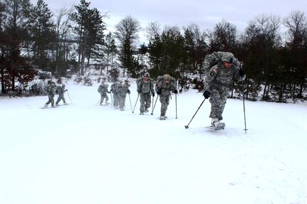 Soldiers with the 181st Multi-Functional Training Brigade participate in a snowshoe skills training session Jan. 26, 2017, at Training Area D-10 as part of the Cold-Weather Operations Course at Fort McCoy. The Cold-Weather Operations Course is the first of its kind coordinated by the Directorate of Plans, Mobilization, Training and Security, or DPTMS. It includes participation by 11 Soldiers with the 181st and is taught by two instructors contracted to support DPTMS. (U.S. Army Photo by Scott T. Sturkol, Public Affairs Office, Fort McCoy)