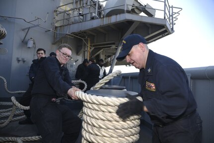 Boatswain’s Mate 2nd Class Jose Garcia, right, from Aurora, Ill., and Seaman William Ford, from Kissimmee, Fla., secure mooring lines on the fantail of amphibious assault ship USS Bonhomme Richard (LHD 6) during sea and anchor detail, Feb. 13, 2017. Bonhomme Richard completed unit-level training to ensure warfighting readiness in preparation for a routine patrol in support of security and stability in the Indo-Asia Pacific region. 

