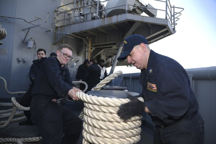 Boatswain’s Mate 2nd Class Jose Garcia, right, from Aurora, Ill., and Seaman William Ford, from Kissimmee, Fla., secure mooring lines on the fantail of amphibious assault ship USS Bonhomme Richard (LHD 6) during sea and anchor detail, Feb. 13, 2017. Bonhomme Richard completed unit-level training to ensure warfighting readiness in preparation for a routine patrol in support of security and stability in the Indo-Asia Pacific region. 

