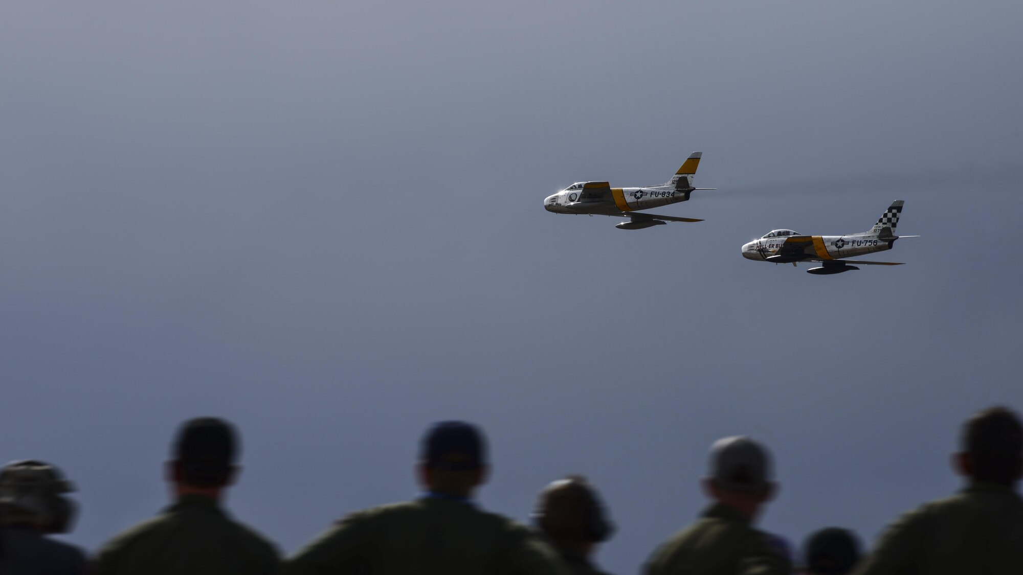 Two F-86 Sabres fly together during the 2017 Heritage Flight Training and Certification Course at Davis-Monthan Air Force Base, Ariz., Feb. 12, 2017. The first production model of the F-86 flew in 1948 and supported the Strategic Air Command from 1949 to 1950. (U.S. Air Force photo by Senior Airman Chris Drzazgowski)