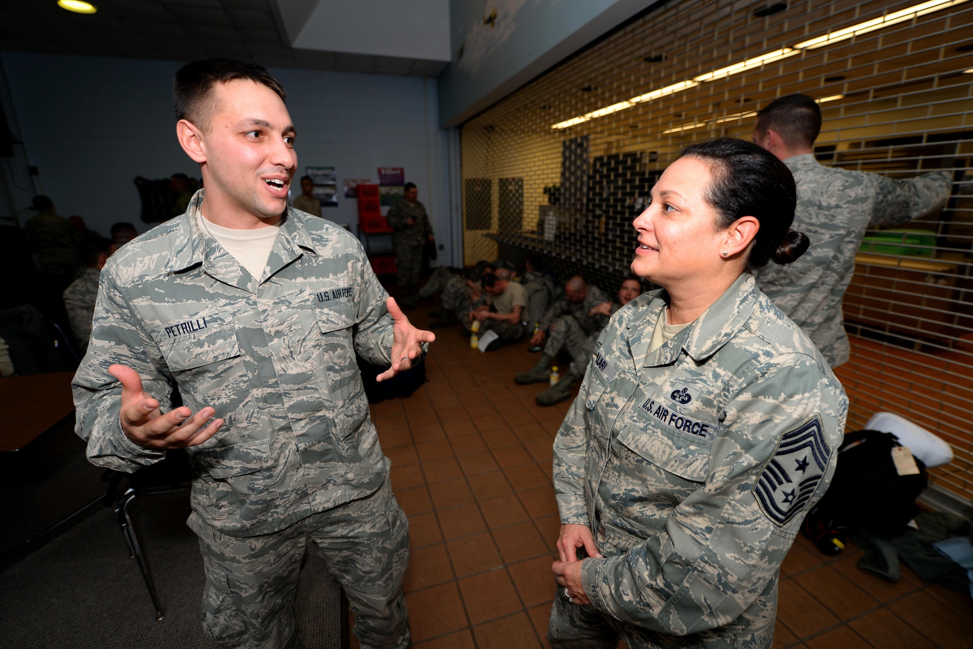 A picture of U.S. Air Force Senior Airman Victor Petrilli, New Jersey National Guardsman with the 177th Fighter Wing Medical Group, speaking to the New Jersey National Guard State Command Chief Master Sgt. Janeen Fillari.