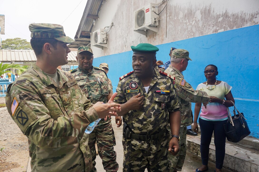 U.S. Army Maj. Aaron Smith, Office of Security Cooperation U.S. Embassy Yaoundé, discusses improvements to the hospital with Cameroonian Col. Abeng Mbozo'o, the chief of the Region 2 Military Clinic, during a visit to the Hopital Militaire de Douala, Feb. 8, 2017. The hospital has received support from both the U.S. military and nongovernmental organizations and serves the entire military and civilian community of Douala.