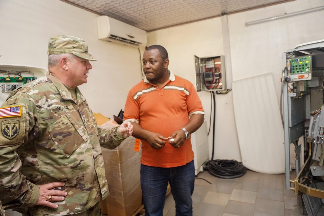 Brig. Gen. Kenneth Moore, the U.S. Army Africa deputy commanding general and Army Reserve Engagement Cell chief, speaks with a radiology technician about the MRI machine at the Hopital Militaire de Douala, Feb. 8, 2017. The hospital has received support from both the U.S. military and nongovernmental organizations and serves the entire military and civilian community of Douala.