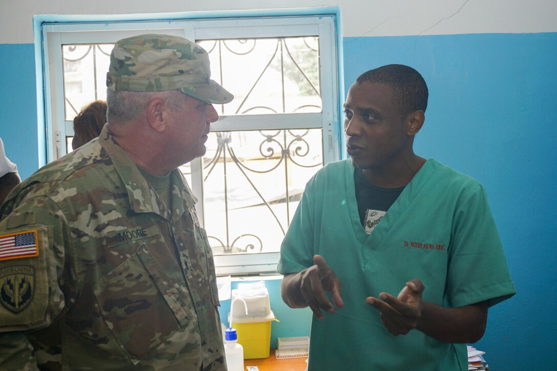 Brig. Gen. Kenneth Moore, the U.S. Army Africa deputy commanding general and Army Reserve Engagement Cell chief, speaks with Dr. Eric Ngoh Akwa about the laboratory facilities and capabilities at the Hopital Militaire de Douala, Feb. 8, 2017. The hospital has received support from both the U.S. military and nongovernmental organizations and serves the entire military and civilian community of Douala.