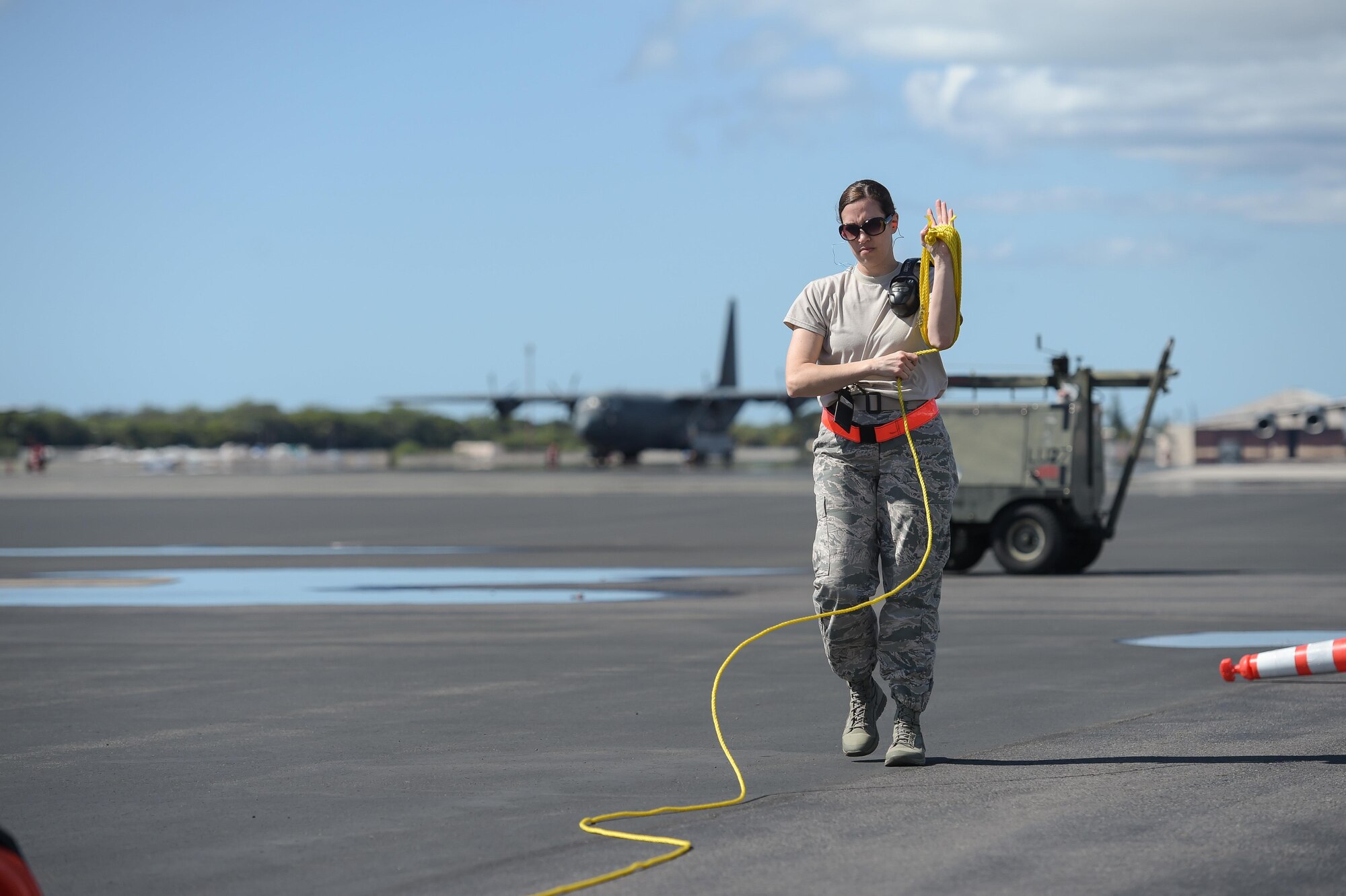 Master Sgt. Angela Leddy, a first sergeant assigned to the 513th Maintenance Squadron, rolls up rope on the flight line Jan. 25 at Joint Base Pearl Harbor-Hickam, Hawaii. Reservists from the 513th Air Control Group deployed to the Hawaiian Islands to provide command and control for Sentry Aloha 17-01, a primarily Reserve and Air National Guard exercise that involves more than 40 aircraft and 1,000 personnel. (U.S. Air Force photo by 2nd Lt. Caleb Wanzer)
