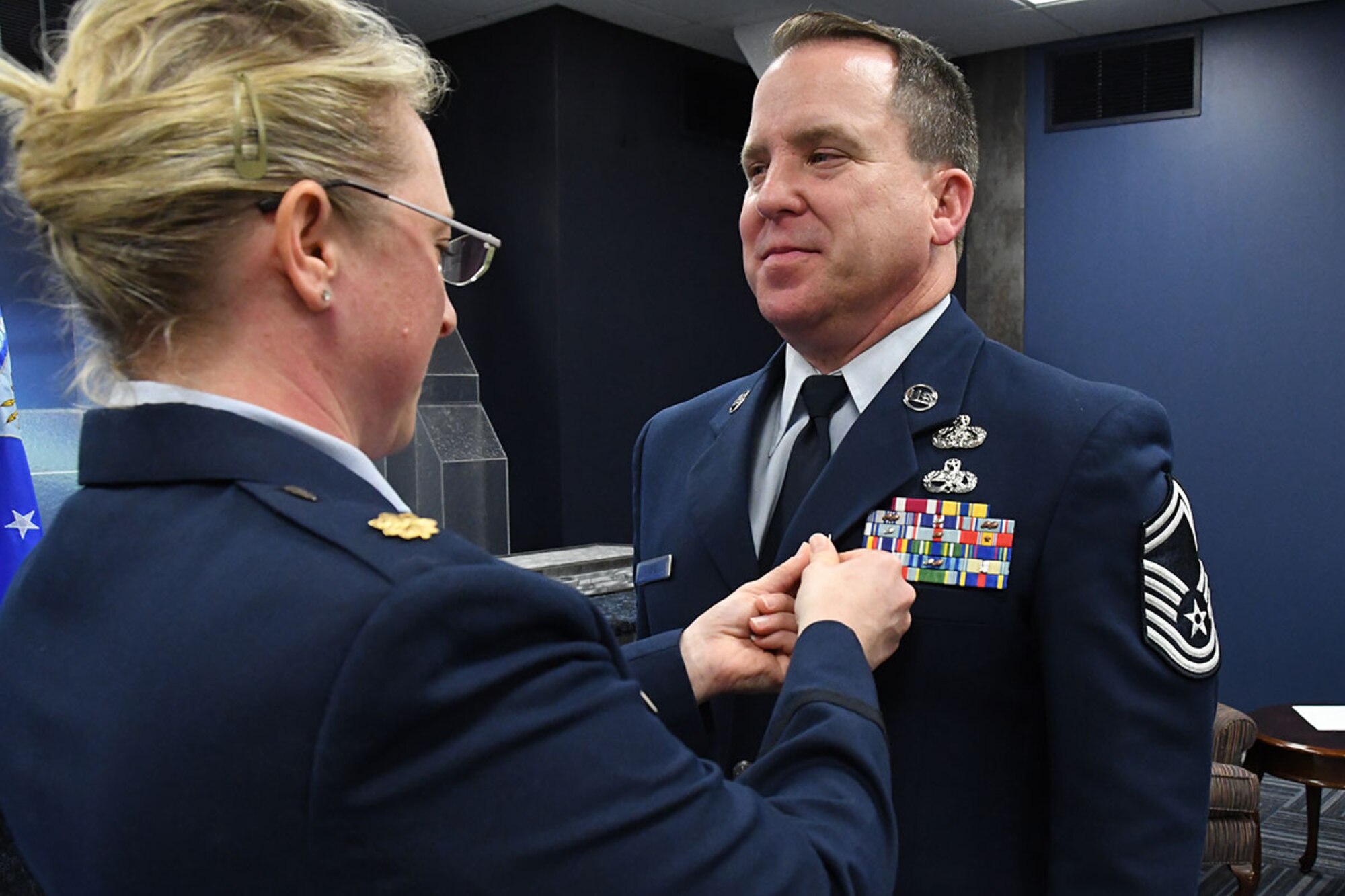 U.S. Air Force Senior Master Sgt. Robert Ahbol,  307th Force Support Squadron communications flight superintendent, receives the Meritorious Service Medal at Barksdale Air Force Base, La. February 11, 2017.  Ahbol’s friends and family come together to celebrate his accomplishments during more than 31 years of service.  (U.S. Air Force photo by Staff Sgt. Callie Ware/Released)