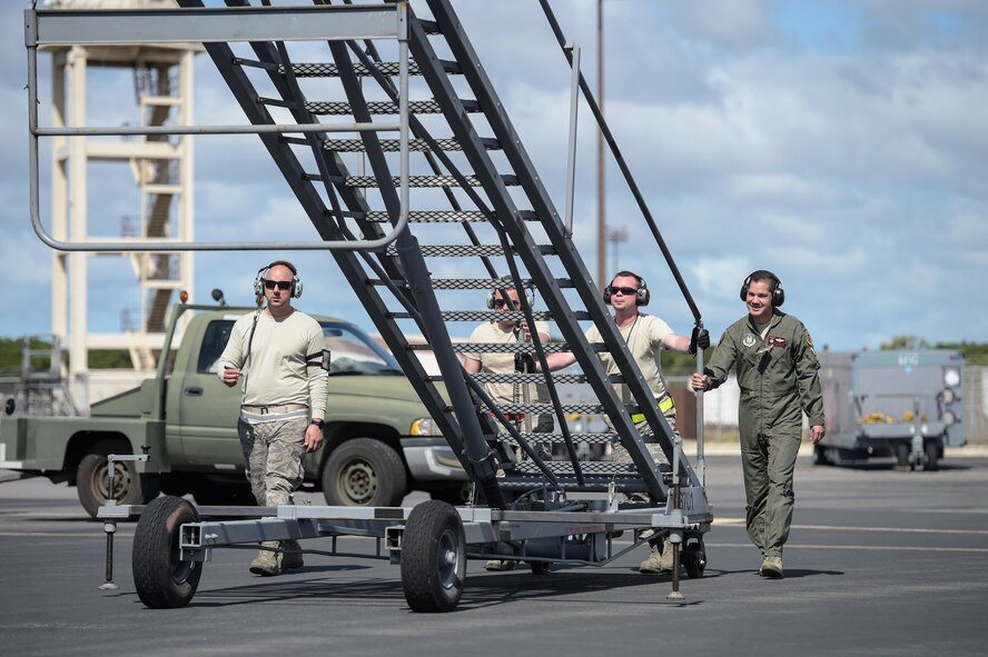Reservists assigned to the 513th Air Control Group move a stand in place Jan. 25 at Joint Base Pearl Harbor-Hickam, Hawaii, after an E-3 Sentry returned from a mission in support of Sentry Aloha. Reservists from the 513th Air Control Group deployed to the Hawaiian Islands to provide command and control for Sentry Aloha 17-01, a primarily Reserve and Air National Guard exercise that involves more than 40 aircraft and 1,000 personnel. (U.S. Air Force photo by 2nd Lt. Caleb Wanzer) (Parts of this image were blurred for security concerns.)