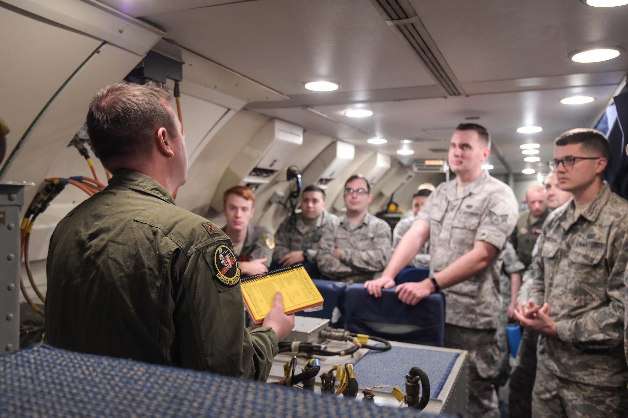 Maj. Matthew Heckman, an air battle manager assigned to the 970th Airborne Air Control Squadron, briefs Airmen assigned to Joint Base Pearl Harbor-Hickam, Hawaii, on Jan. 31 before a mission in support of Sentry Aloha. Reservists from the 513th Air Control Group deployed to the Hawaiian Islands to provide command and control for Sentry Aloha 17-01, a primarily Reserve and Air National Guard exercise that involves more than 40 aircraft and 1,000 personnel. (U.S. Air Force photo by 2nd Lt. Caleb Wanzer)