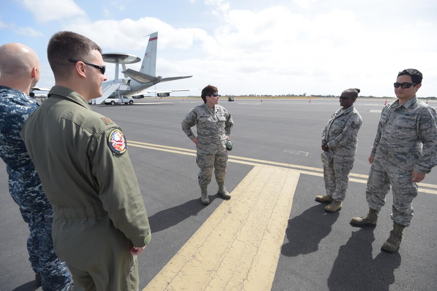 Lt. Col. Gia Wilson-Mackey, the 513th Aircraft Maintenance Squadron Commander, answers questions on Jan. 31 during a static display tour of an E-3 Sentry at Joint Base Pearl Harbor-Hickam, Hawaii. Reservists from the 513th Air Control Group deployed to the Hawaiian Islands to provide command and control for Sentry Aloha 17-01, a primarily Reserve and Air National Guard exercise that involves more than 40 aircraft and 1,000 personnel. (U.S. Air Force photo by 2nd Lt. Caleb Wanzer)