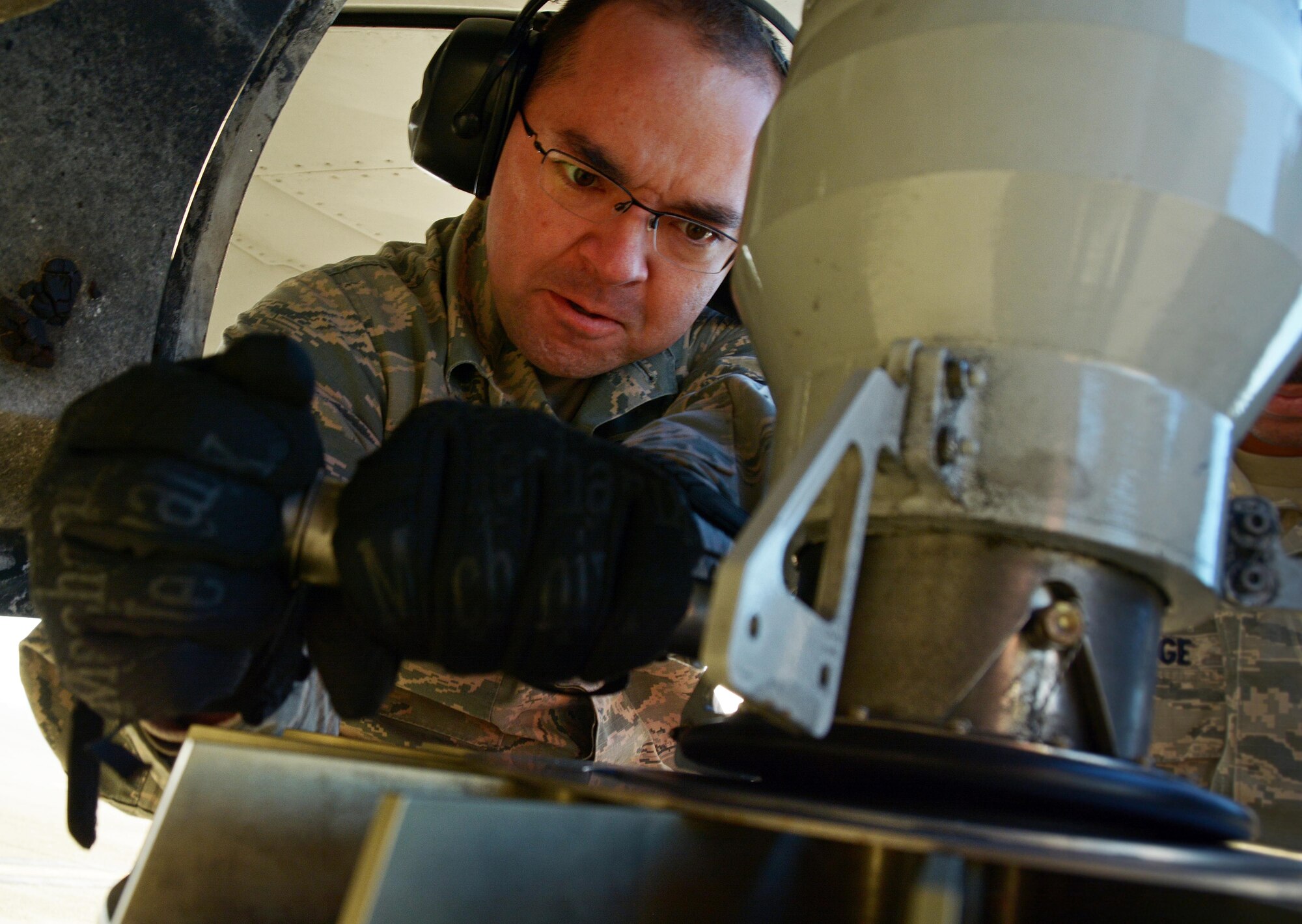 Senior Airman Brandon Mayfield, 945th Aircraft Maintenance Squadron crew chief, works on a stabilizer strut for a C-17 Globemaster III prior to its take off from Travis Air Force Base, Calif., for Patriot Wyvern on Feb. 11, 2017. Patriot Wyvern is a hands-on, bi-annual event conducted by the 349th Air Mobility Wing designed to hone combat skills and improve organizational interoperability. (U.S. Air Force photo/Staff Sgt. Daniel Phelps)