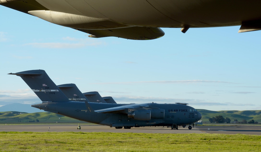 C-5M Super Galaxies sit on the flightline of Travis Air Force Base, Calif., on Feb. 11, 2017. The C-5 has a greater capacity than any other airlifter. It has the ability to carry 36 standard pallets and 81 troops simultaneously. (U.S. Air Force photo/Staff Sgt. Daniel Phelps)