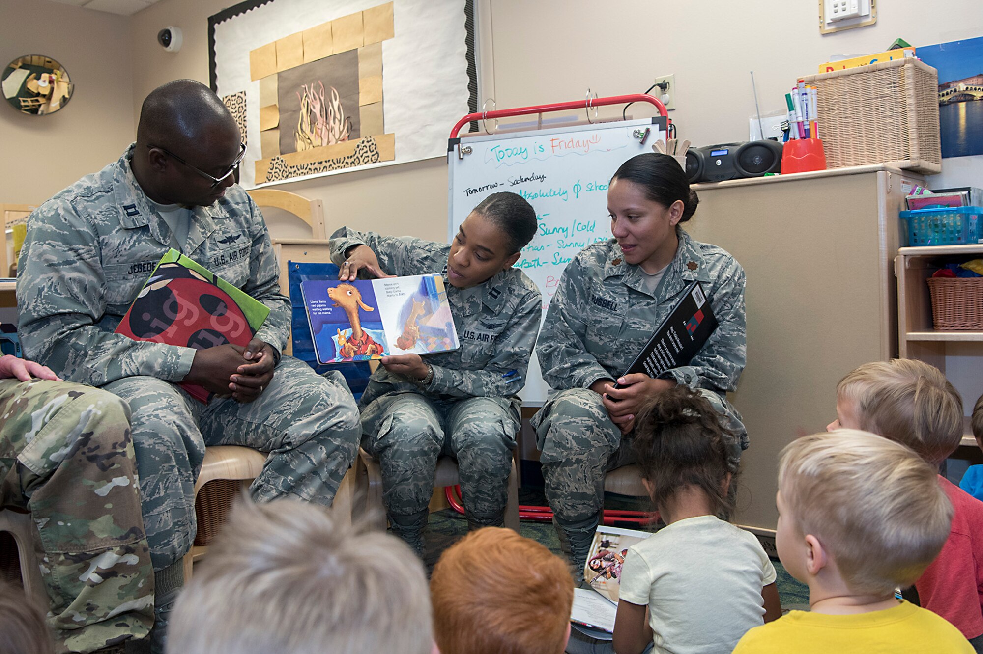 PETERSON AIR FORCE BASE, Colo., Capt. Celeste Oliver, 21st Operations Support Squadron, flight commander plans and projects, reads a book to the children of the Peterson Air Force Base Child Development Center, Feb. 10, 2017. The book reading was part of the CDC celebration of National African-American History Month (U.S. Air Force photo by Steve Kotecki)